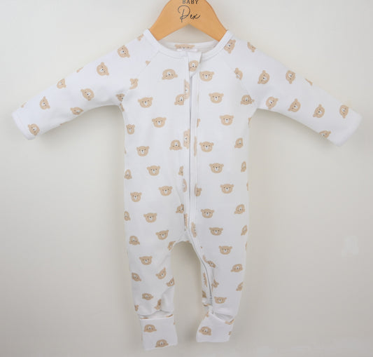 Baby onesie with bear pattern on a hanger against a white background