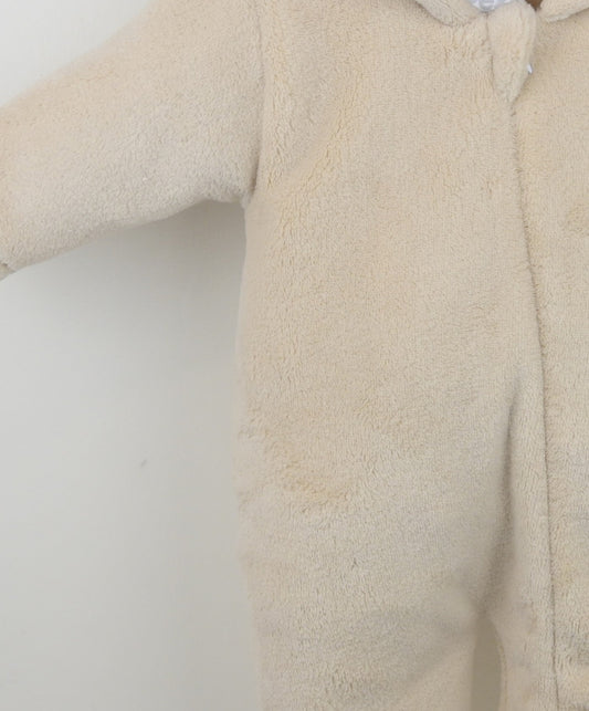 Beige fleece baby onesie on a white background