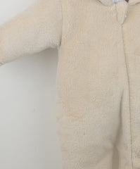 Beige fleece baby onesie on a white background
